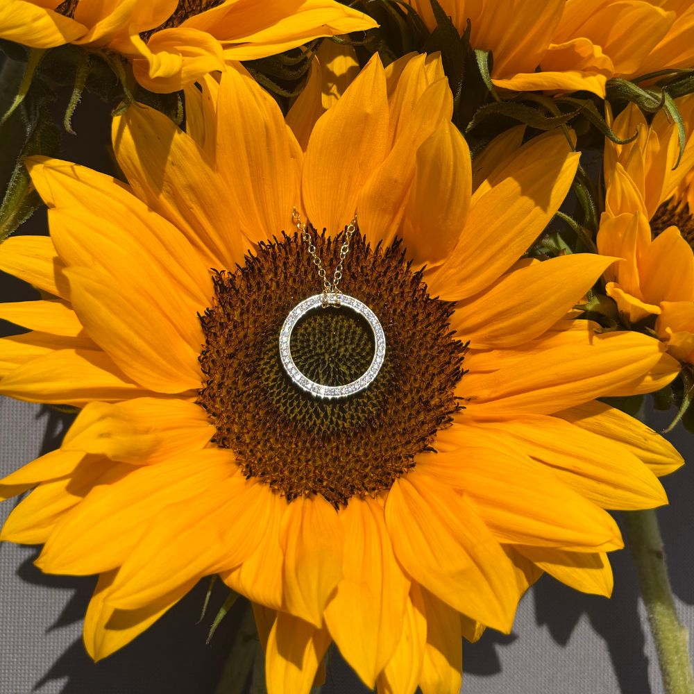 White Gold Circle of Life Necklace with Sky Blue Topaz