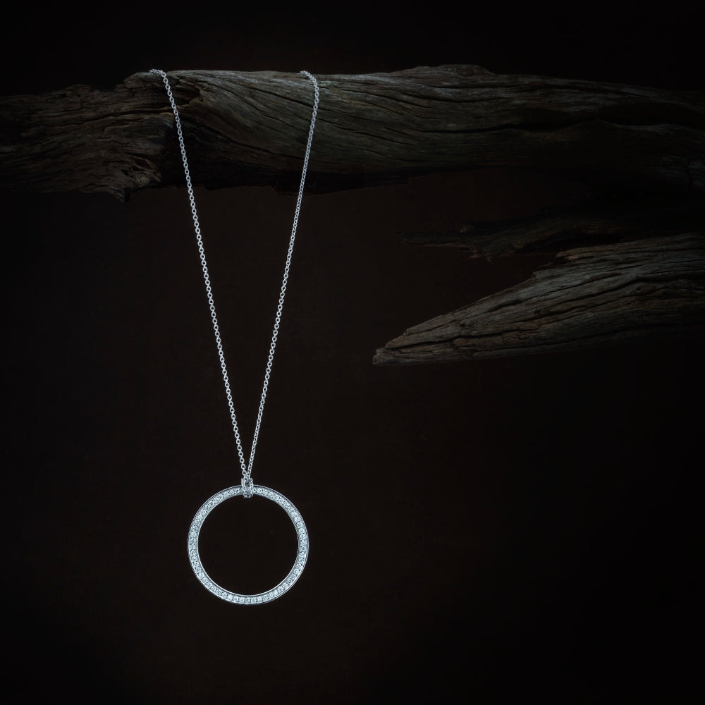 White Gold Circle of Life Necklace with Sky Blue Topaz